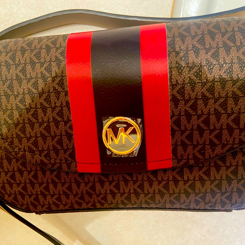 Brand new Michael Kors Fanny pack with gold MK detail.